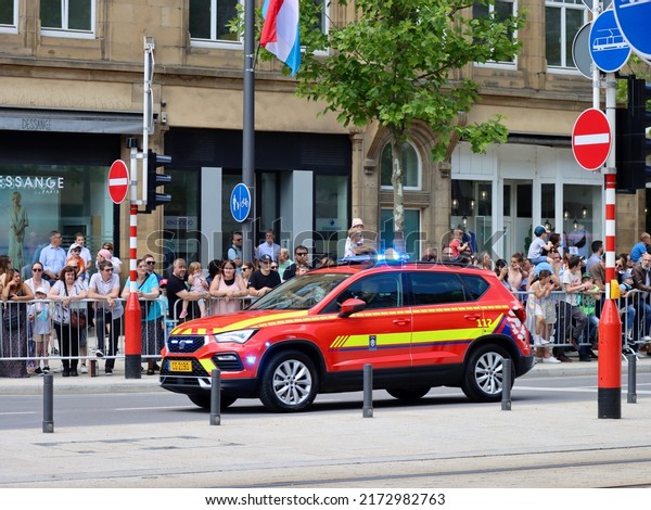 Red ambulance van on National day parade.\
Luxembourg, Luxembourg - June 23,\
2022