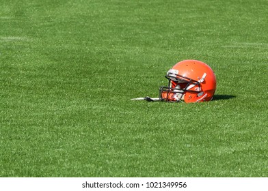 Red American Football Helmet On Astroturf