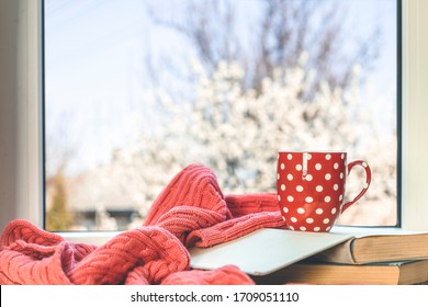 Red ann white dotted cup of coffee  on the window sill. - Shutterstock ID 1709051110