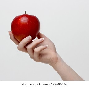 Red apple in beutiful hand
