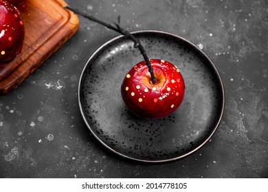 Red Apple In Caramel With Sugar Decor, An Original Treat For A Festive Halloween Table