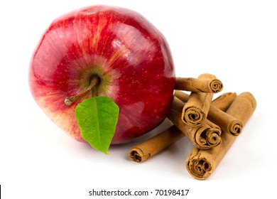 Red Apple And Cinnamon  Sticks Isolated On White