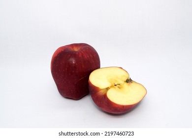 Red Apple And Red Apple Cut In A Half Photo On A White Background