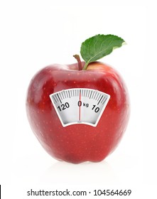Red apple diet and weight loss scale concept