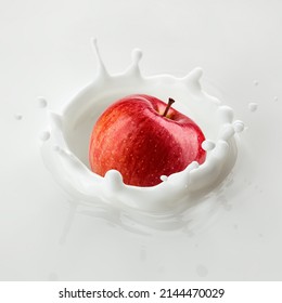 Red Apple Falls Into Milk, Yoghurt, Sour Cream, Splash