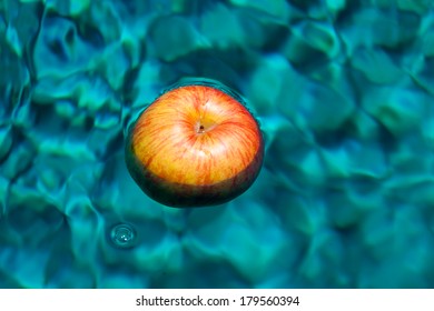 Red Apple Floating In The Water 