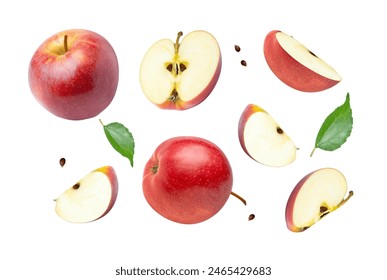 Red apple with green leaf and half slice flying in the air isolated on white background.