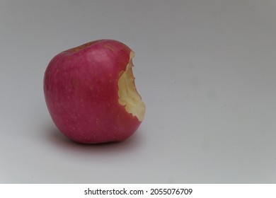 Red Apple With Human Bite Marks Like A World Famous Company Logo