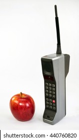 Red Apple And Large Old Brick Style Cell Phone.