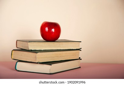 Red Apple On The Book On Desk