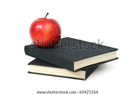 red apple on a book isolated on white