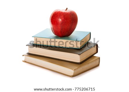 Red apple on books. White background