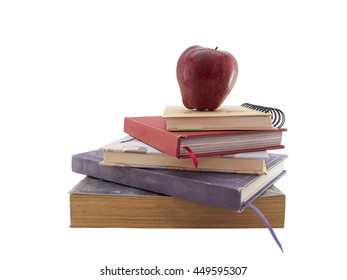 Red apple on stack of book isolated on white background