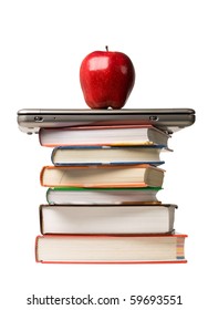 Red Apple On Top Of Laptop Computer And A Stack Of School Books. Concept Of Education.