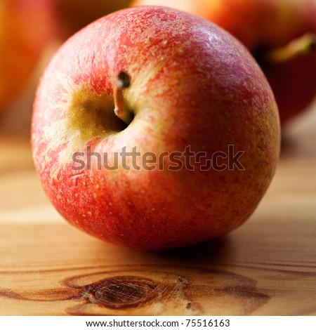 Red apple on wood table