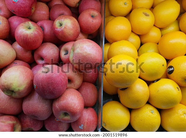 Red
apple and orange brand Zest Fresh fruits at the shelf. Plastic
divider in between. Supermarket. Malaysia. July
2021