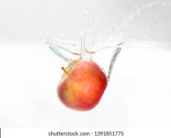 Red Apple Spash In Water On White Background