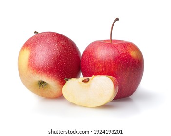 red apples with juicy section isolate on white