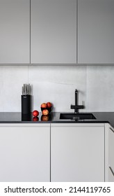 Red Apples On Ablack Kitchen Counter. Gray Kitchen.