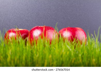 Red apples on grass