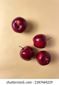 Red Apples On Pale Orange Background Flatly 