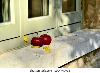 Red Apples On A Stone Windowsill