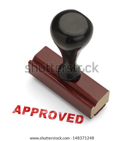 Red Approved Stamp with Wooden handle Rubber Stamper Isolated on White Background.