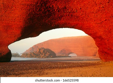 Red Archs On Atlantic Ocean Coast. Marocco