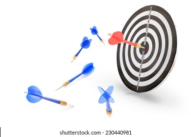 The Red Arrow Achieved Hit Center Target Of Dart Board With Blue Darts Miss And Failure Isolated On White Background. 