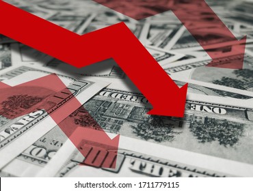 Red Arrow Icon On A Background Of Money. The Concept Of Changing Course Of US Dollar On The Market. Devaluation, Collapse, Stagnation Of The Economy. Pandemic, Quarantine, Coronavirus COVID-19.