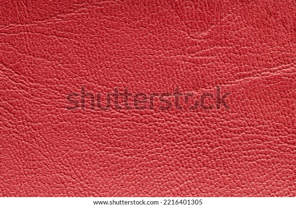 Red\
artificial or synthetic leather background with neat texture and\
copy space, colorful fabric sample with leather-like finish aimed\
for upholstery, fashion, sewing or footwear\
projects