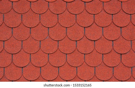 Red Asphalt Roof Shingles As A Background.