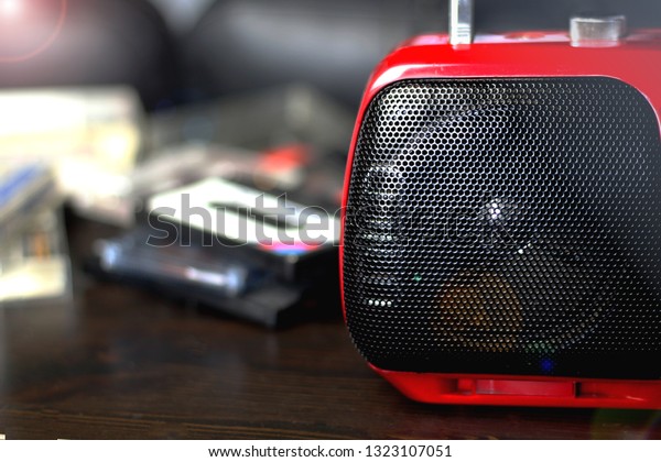 Red audio boom box with black speaker closeup retro\
vintage 90\'s style