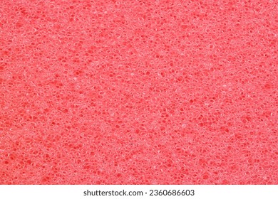 Red background of foam sponge, macro photo - Shutterstock ID 2360686603