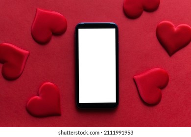Red background with hearts and tablet, st. Valentine day concept - Shutterstock ID 2111991953