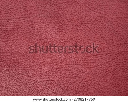 Red background with reptile scale pattern. 