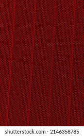 Red background of wavy metallic grid with holes. Metal mesh as background. Perforated metal back. 