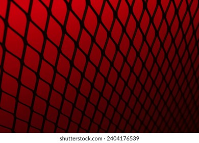 Red background of wavy red metallic grid with holes. Metal mesh as background. Perforated metal back.