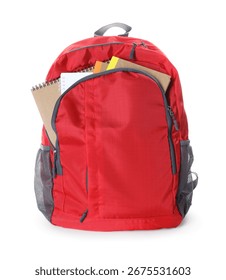 Red backpack with notebooks isolated on white