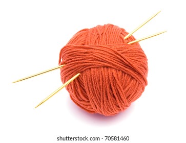 Red Ball Of Wool And Knitting Needles Isolated On White Background