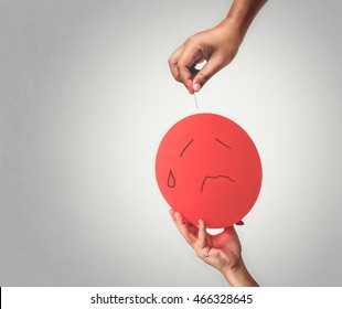 Red Balloon And Needle In Hand