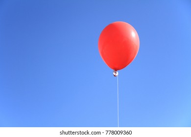 red balloon under the blue sky - Powered by Shutterstock