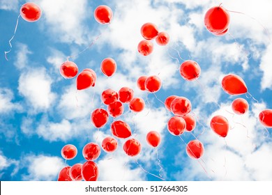 red balloons in the blue sky - Powered by Shutterstock