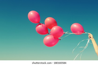 red balloons on the background of blue sky - Shutterstock ID 180183584