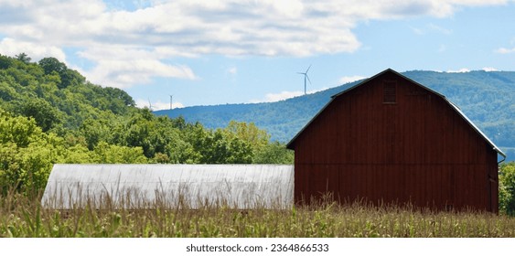 Red barn along the growing corn with mountain range windmills turning Mehoopany Pennsylvania Jaynes Bend - Powered by Shutterstock