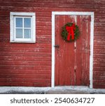 Red barn door with wreath 