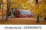 Red barn in fall color in October.