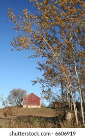 red barn with trees