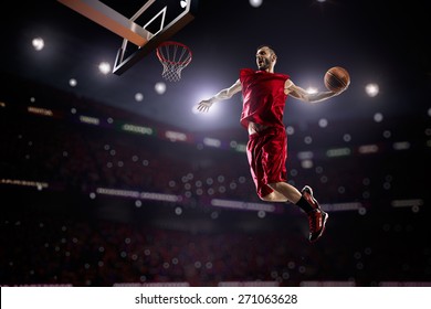 Red Basketball Player In Action In Gym