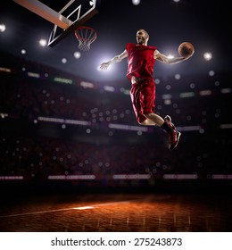 Red Basketball Player In Action In Gym